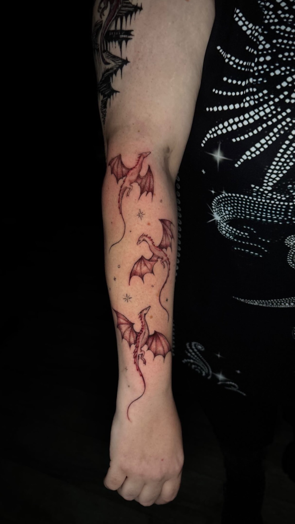 Little red dragons up an arm